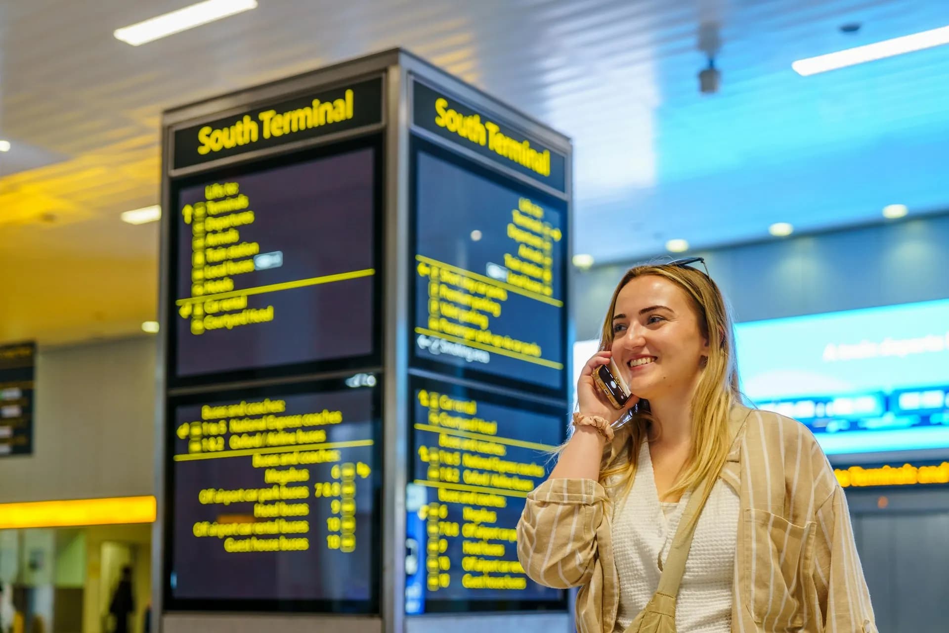 Traveller using the BoardingPlus app in an airport terminal